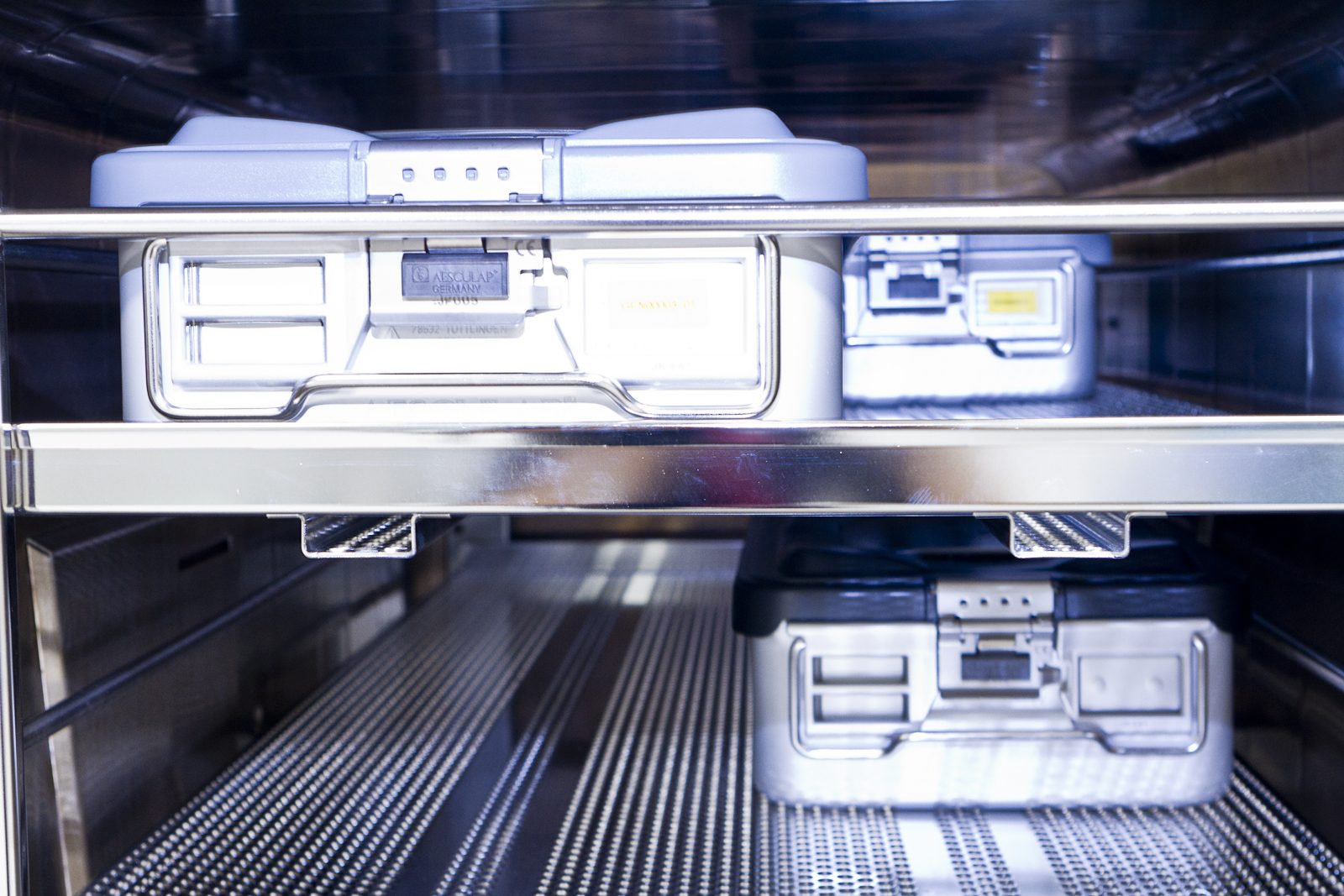 Sterile instrument containers racked and secured for SteriChain monitored transport