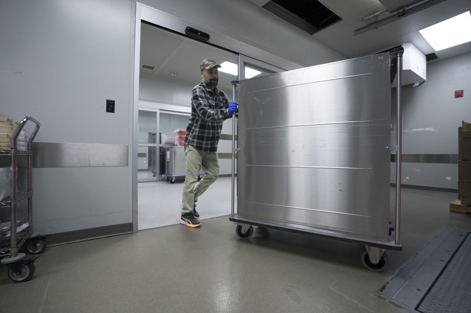 Sterile transport cart moving through the dock doors at the SteriPro centralized facility